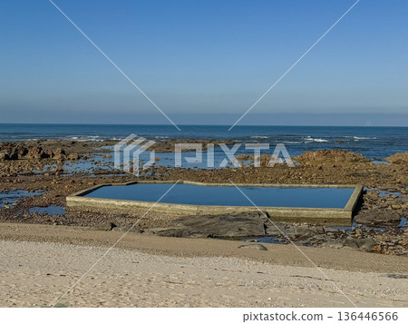 Rectangular ocean tidal pool, rocky shoreline, calm Atlantic horizon in Portugal, Viana de Castelo along Camino de Santiago. Tourism, coastal travel, outdoor recreation, wellness retreats 136446566