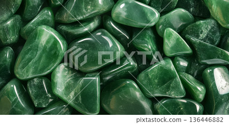 Emerald green jade stone background with smooth polished texture, luxury mineral. Emerald green jade stone background with smooth polished texture, luxury mineral. 136446882