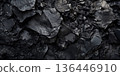 Dark basalt stone background with deep black volcanic rock texture, rough and porous surface. 136446910