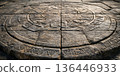 Ancient temple stone background with intricate carvings on weathered stone slabs. 136446933