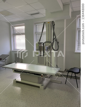 Modern Overhead Xray System With Examination Table In Clinic. Diagnostic Imaging Technology For Radiology Procedures. Modern Overhead Xray System With Examination Table In Clinic. Diagnostic Imaging Technology For Radiology Procedures. 136448000