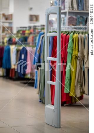 Anti-theft security gate at the entrance of a clothing store 136448158