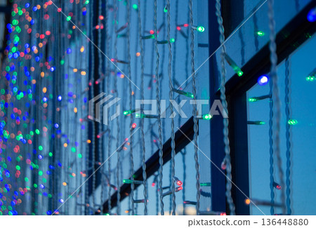 Festive decoration of office buildings, lights electric garland with lights 136448880