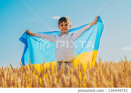 Happy Little Boy Ukrainian Patriot Child With National Flag On Wheat Background  136449781