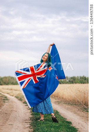 Young Woman With Vibrant Blue Hair Proudly Stands Outside Waving New Zealand Young Woman With Vibrant Blue Hair Proudly Stands Outside Waving New Zealand 136449788
