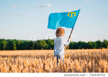 Crimean Tatar Boy Holding National Flag In Wheat Field.eastern European Identity 136449792