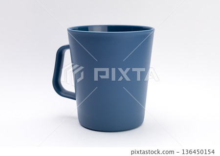 Blue plastic cup on a white background 136450154