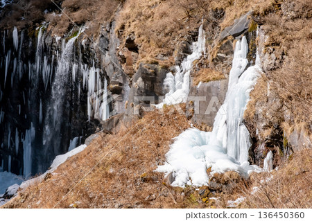 Frozen icicles forming at Kegon Falls in Nikko Frozen icicles forming at Kegon Falls in Nikko 136450360