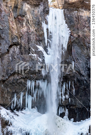 Frozen icicles forming at Kegon Falls in Nikko 136450376