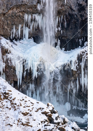 Frozen icicles forming at Kegon Falls in Nikko Frozen icicles forming at Kegon Falls in Nikko 136450389
