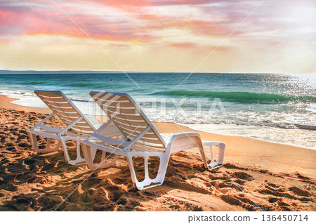 Pair of Beach chairs next to calm water of Sea or Ocean Pair of Beach chairs next to calm water of Sea or Ocean 136450714