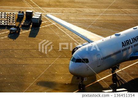 The cockpit of a passenger plane illuminated by the setting sun The cockpit of a passenger plane illuminated by the setting sun 136451354