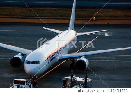 One World painted aircraft departing at dusk One World painted aircraft departing at dusk 136451361
