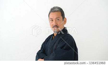 A man wearing a kimono A man wearing a kimono 136451960