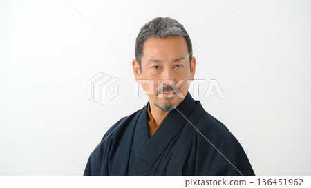 A man wearing a kimono A man wearing a kimono 136451962