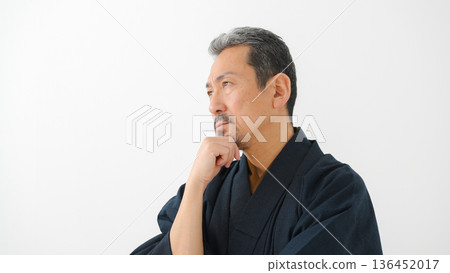 A man wearing a kimono A man wearing a kimono 136452017