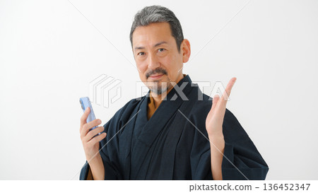 Man wearing kimono, smartphone, smartphone Man wearing kimono, smartphone, smartphone 136452347
