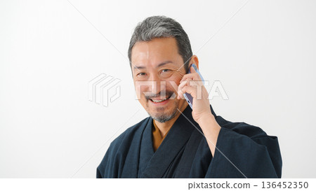 Man wearing kimono, smartphone, smartphone Man wearing kimono, smartphone, smartphone 136452350