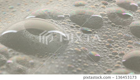 Many bubbles foam from soap bath shampoo shower gel on surface. Fluffy bath foam or beer bubble froth on surface wave curve texture form bubble 136453173