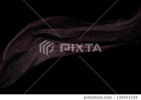 Purple Silver lace fabric flying in curve shape, Piece of textile purple silver lace fabric throw fall in air. Black background isolated, dark shading environment 136453184