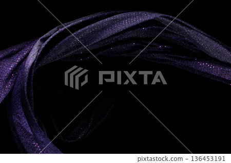 Purple violet glitter fabric flying in curve shape, Piece of textile Purple violet glitter fabric throw fall in air. Black background isolated, dark shading environment Purple violet glitter fabric flying in curve shape, Piece of textile Purple violet glitter fabric throw fall in air. Black background isolated, dark shading environment 136453191