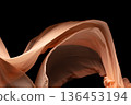 Orange Organza fabric flying in curve shape, Piece of textile Orange Organza fabric throw fall in air. Black background isolated, dark shading environment 136453194