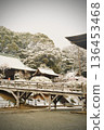 A Japanese garden enveloped in silence in winter. Historic buildings covered in snow. 136453468