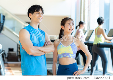 Men and women training in the gym Men and women training in the gym 136454881
