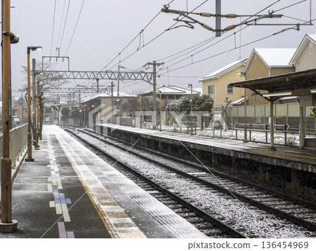 Snowing train station 136454969