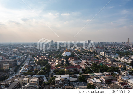 An aerial perspective offers a breathtaking view of Wat Saket, the temple standing tall amid the hustle and bustle of Bangkok's housing. shot date 6 Nov 2018. 136455160
