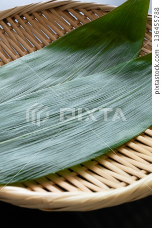 Bamboo leaves and strainer Food background material Bamboo leaves and strainer Food background material 136455788