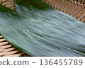Bamboo leaves and strainer Food background material 136455789