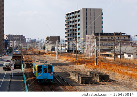 Kurashiki cityscape and Mizushima Rinkai Railway MRT300 series "Himawari" train 136456014