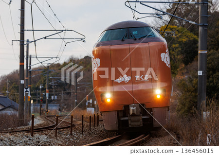 JR West 273 Series Limited Express "Yakumo" running through an S-curve at dusk 136456015