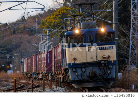 EF64 DC electric locomotive descending an S-curve mountain pass 136456016