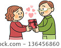 Smiling senior couple giving a gift on Valentine's Day 136456860