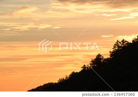 Morning glow at the foot of the mountain Morning glow at the foot of the mountain 136457360
