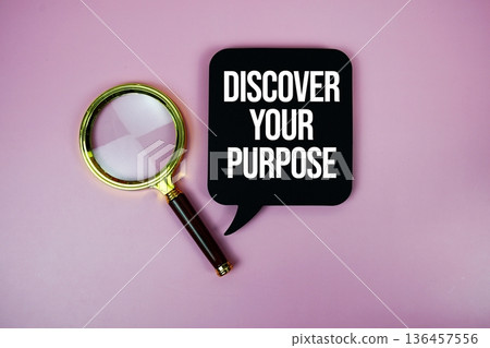 Discover Your Purpose text on speech bubble with magnifying glass on pink background 136457556