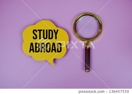 Study Abroad text on speech bubble with magnifying glass on purple background Study Abroad text on speech bubble with magnifying glass on purple background 136457559