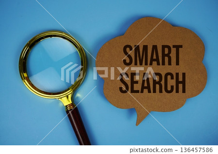 Smart Search text on speech bubble with magnifying glass on blue background Smart Search text on speech bubble with magnifying glass on blue background 136457586