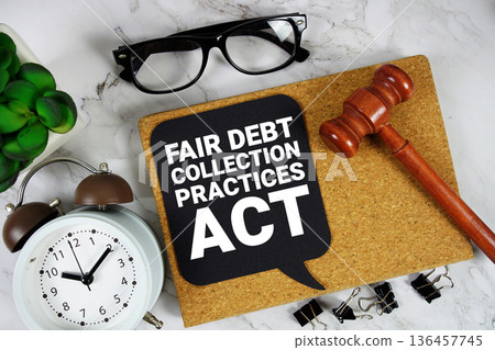 Fair Debt Collection Practices Act text on speech bubble with alarm clock and wooden gavel on marble background Fair Debt Collection Practices Act text on speech bubble with alarm clock and wooden gavel on marble background 136457745