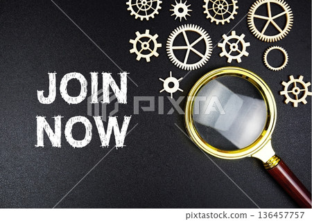 Join Now text message with magnifying glass on black background 136457757