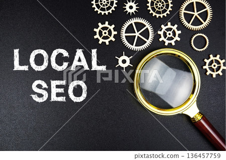 Local SEO text message with magnifying glass on black background 136457759