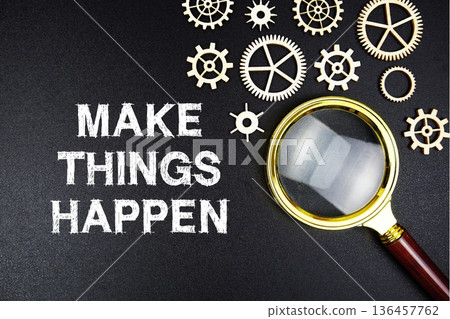 Make Things Happen text message with magnifying glass on black background Make Things Happen text message with magnifying glass on black background 136457762