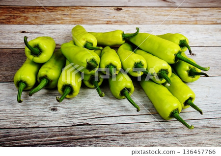 Fresh Raw Green Bell Pepper or capsicum on wooden background Fresh Raw Green Bell Pepper or capsicum on wooden background 136457766