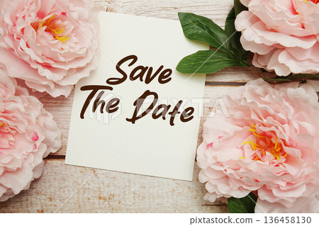 Save The Date text with flowers bouquet on wooden background 136458130