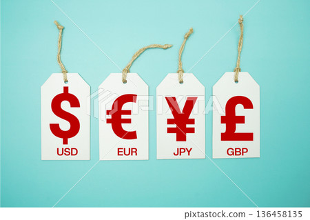 Price tag with "Currency of USD, EUR, JPY, GBP" is placed on blue background Price tag with "Currency of USD, EUR, JPY, GBP" is placed on blue background 136458135