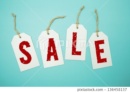 Price tag with "Sale" is placed on blue background 136458137