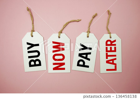 Price tag with "Buy Now Pay Later" is placed on pink background 136458138