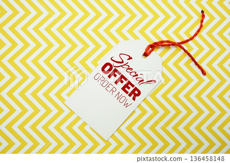 Price tag with "Special Offer Order Now" is placed on a colorful zigzag patterned background 136458148